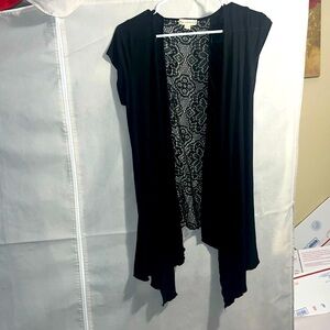 Black sleeveless with lace back.